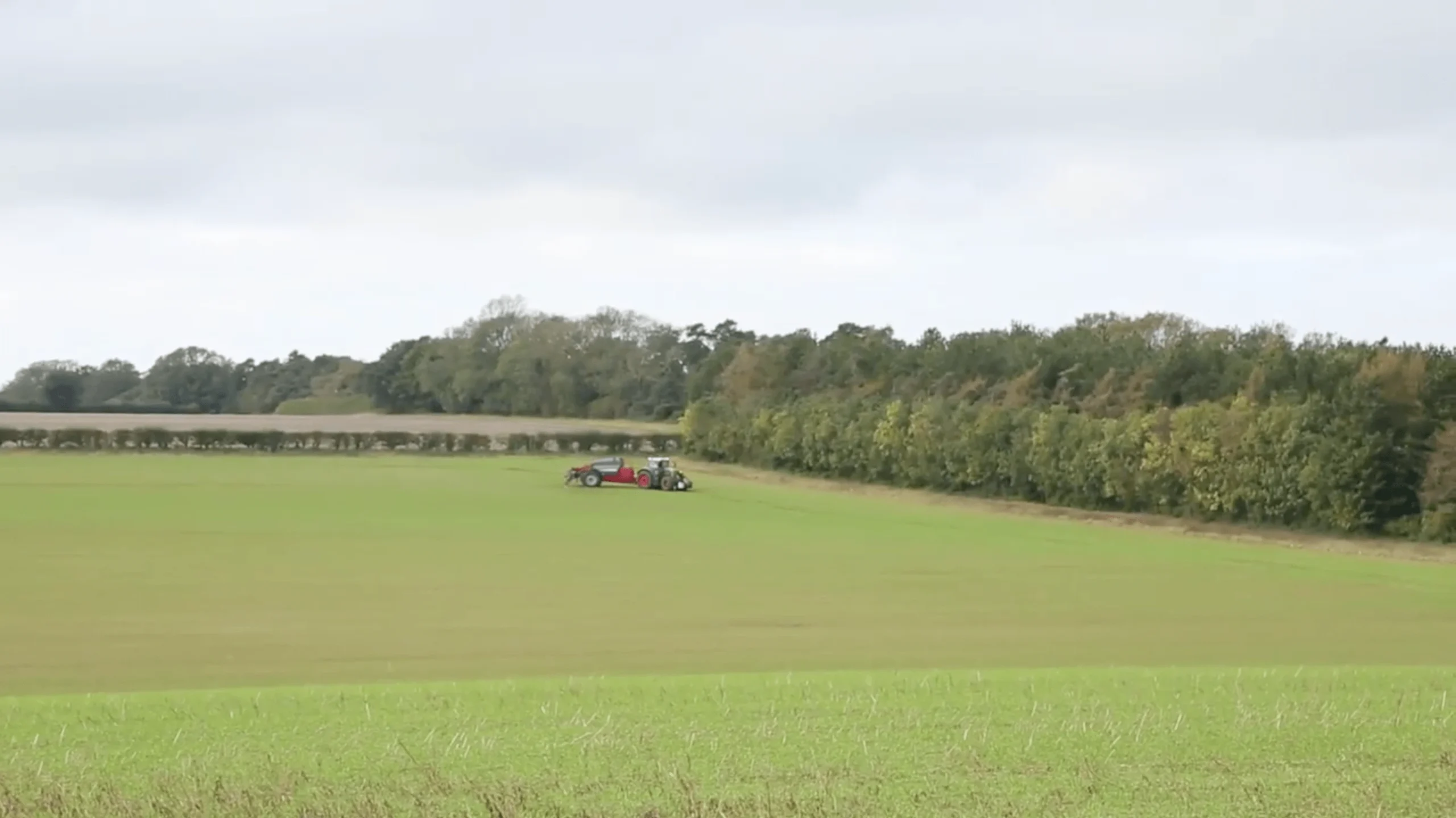 Geofolia Tractor In a Field Image